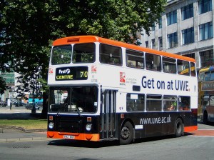 An old Leyland bus in orange and black livery promoting the University of the West of England
